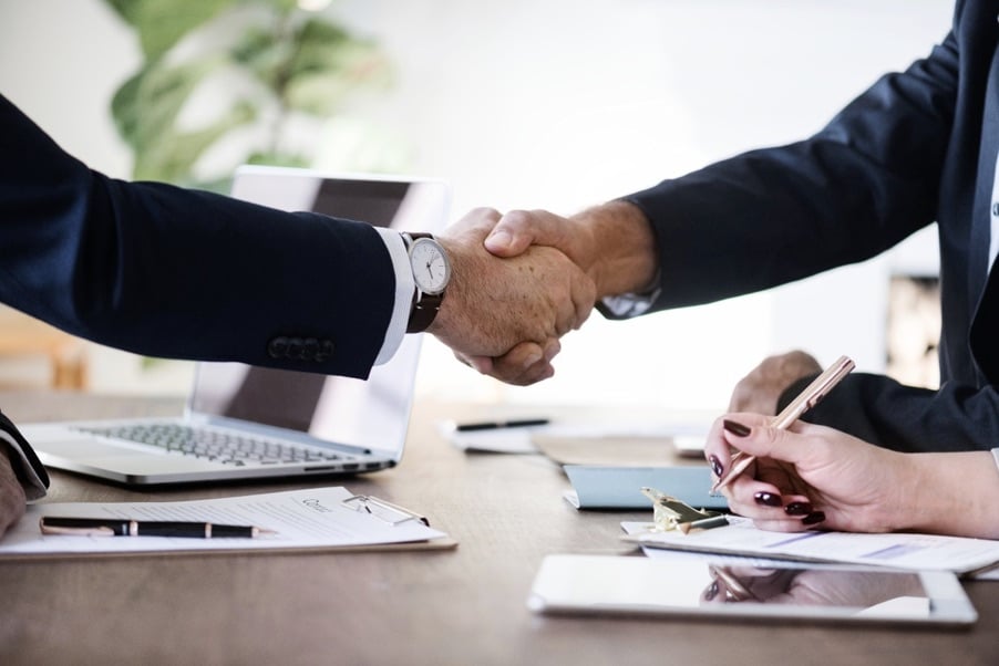 Join Osirium at the Strategic IT Security meeting on October 10th, 2018 A pair of businessmen in suits shaking hands