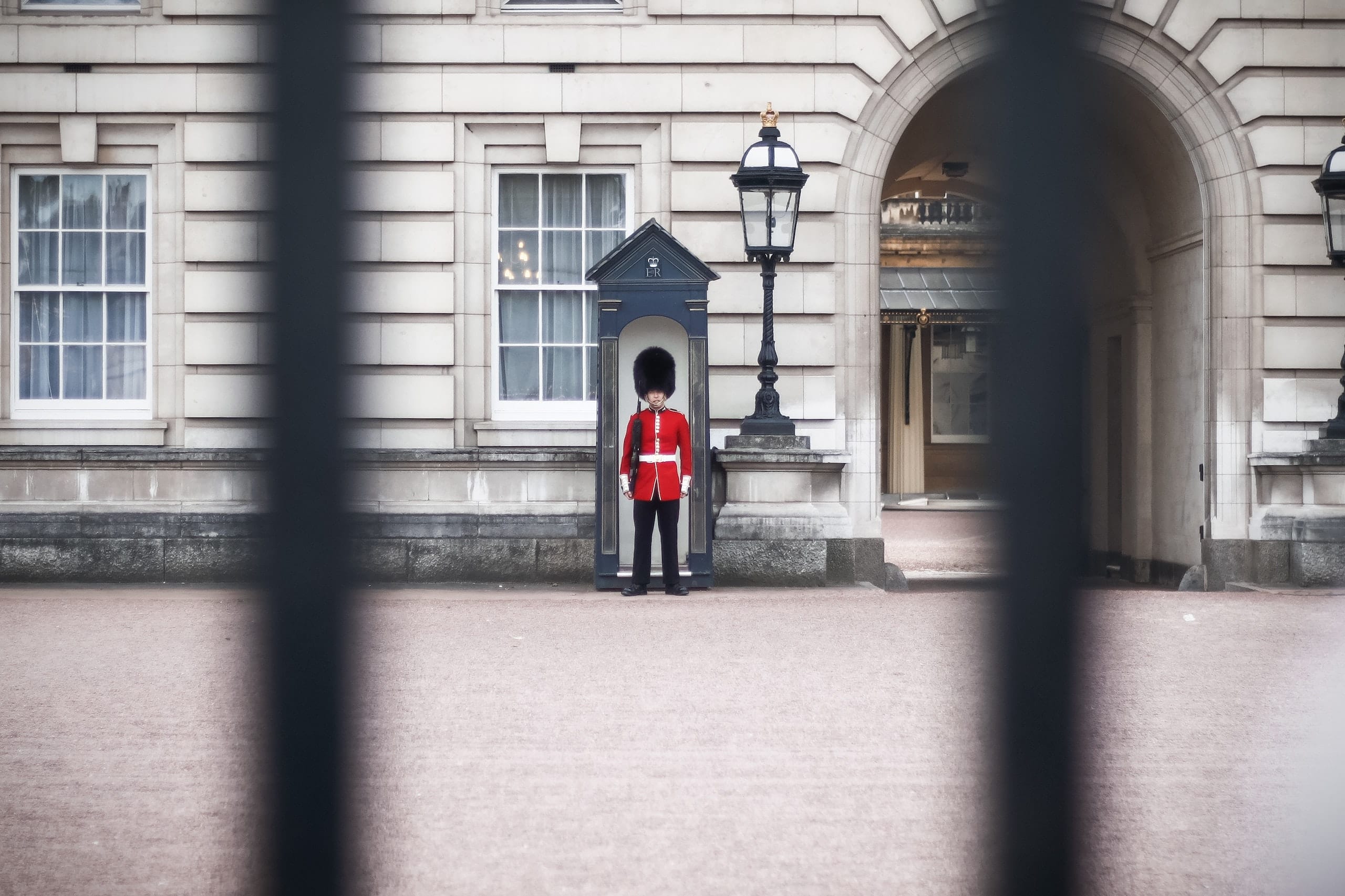 Separate people from passwords A royal guard standing in front of a closed door