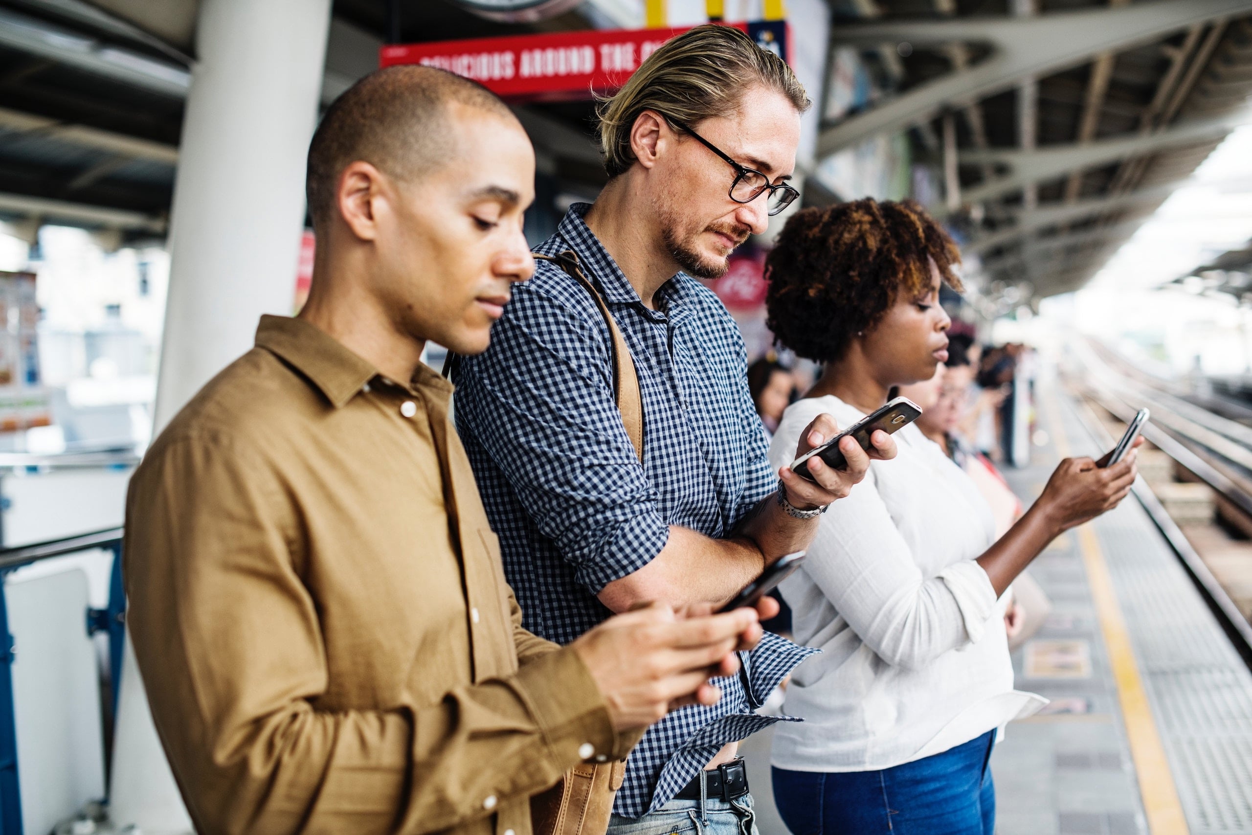 The O2 outage, how task automation could help People standing at a train station looking at their mobile phones